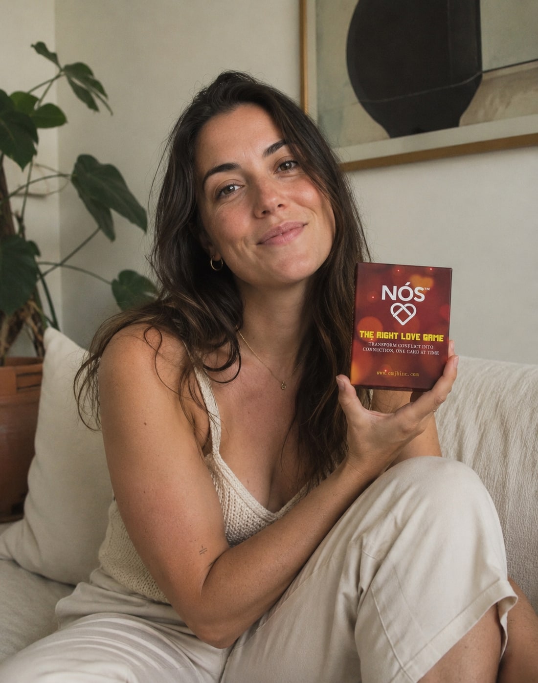 A person holding NÓS The Right Love Game box